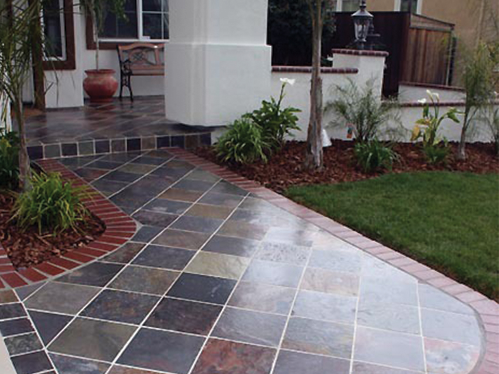 Wet outdoor stone patio treated with SKID SAFE
